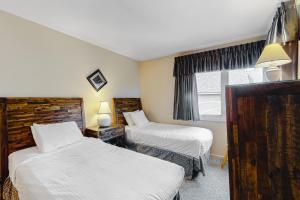 a hotel room with two beds and a window at Brookhaven D4 in Ludlow +15 photos