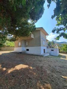 a building with a large yard in front of it at Margareth suite and terrace in San Lucido +15 photos