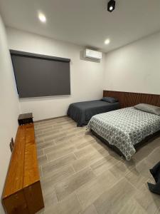 Postel nebo postele na pokoji v ubytování Casa Barcelona