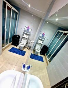 a bathroom with two sinks and two stools at Nobilium in Meknès