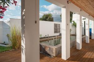 an external view of a house with a swimming pool at La Kazaka Terre Sainte in Saint-Pierre +24 photos