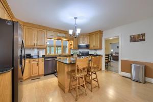 a kitchen with wooden cabinets and a table and chairs at Blue Ribbon Homestead in Biglerville