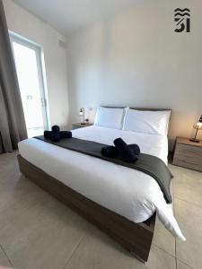 Ένα ή περισσότερα κρεβάτια σε δωμάτιο στο M31Stays - St Paul's Modern Apartments and Penthouse