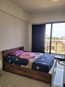 Ένα ή περισσότερα κρεβάτια σε δωμάτιο στο 日曜居