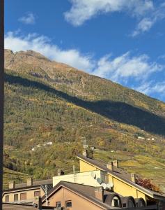 a view of a hill with a mountain in the background at L'Atelier - 2 min walk to Bernina Express in Tirano
