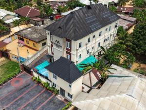 an overhead view of a large house with a pool at Masters Class Apartments in Mama