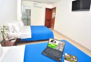 TV a/nebo společenská místnost v ubytování Hotel Getsemaní BGA