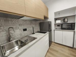 a kitchen with a sink and a counter top at casa Mimi in Taggia +6 photos