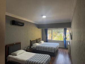 Ένα ή περισσότερα κρεβάτια σε δωμάτιο στο Kılıç AirPort otel