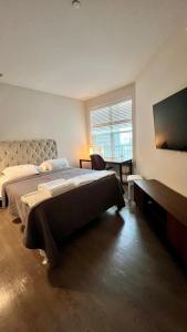 Ένα ή περισσότερα κρεβάτια σε δωμάτιο στο Altura Apartment Arlington