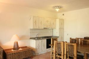Køkken eller tekøkken på Perla Del Porto Apartments