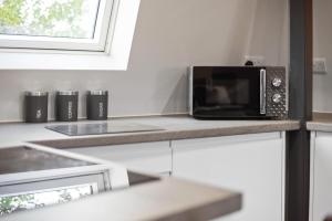 Køkken eller tekøkken på Edinburgh City Penthouse Studio + 8 billeder