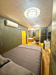 a bedroom with a large bed in a room at Taksim Luxury Arcadia Hotel in Istanbul