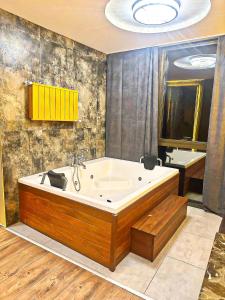 a large bathroom with a large tub in a room at Taksim Luxury Arcadia Hotel in Istanbul
