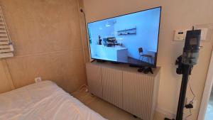 a room with a large screen tv in a room at Forest SB02 in Seoul