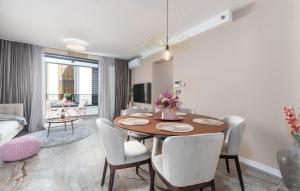 a living room with a dining room table with chairs at Val di Bora in Poreč