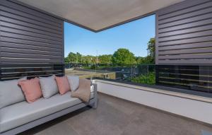 a balcony with a couch and a large window at Val di Bora in Poreč