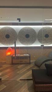 een glazen vitrine in een woonkamer met een bank bij Sofia Hotel & Spa Truskavets in Truskavets