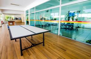 a ping pong table in the middle of a room at Resort Internacional DiRoma in Caldas Novas