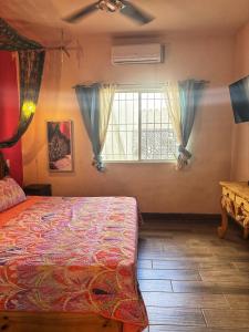 a bedroom with a bed and a window at Casita El Nido- Spacious 2 Bedroom Main Floor Apartment in Bucerías
