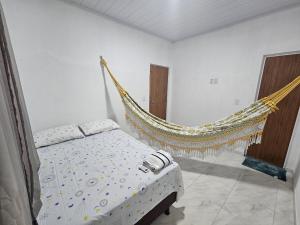 En eller flere senge i et værelse på Chalé Dunas de Prata