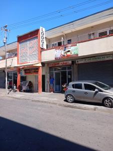 a silver car parked in front of a building at Lookout Star Legend Accommodation in Parow