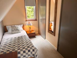 a small bedroom with a bed and a window at Trevithick 46 in Hayle +21 photos