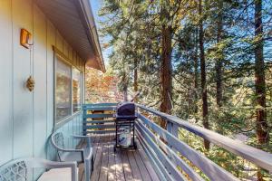 a grill sitting on the front porch of a house at The Treehouse in Lake Arrowhead