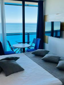 Ένα ή περισσότερα κρεβάτια σε δωμάτιο στο ORBI City ORIGINAL