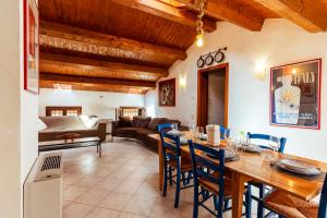 a kitchen and living room with a table and chairs at Elegant Attic-Rovigo Center-6 people in Rovigo