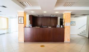 a lobby with a reception desk in a building at Hotel Kastri in Nea Mesangala