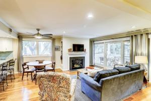 a living room with a couch and a table at SG6A: 6A Seagrove Villa in Isle of Palms