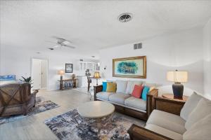 a living room with a couch and a table at 27305 Voyageur in Punta Gorda