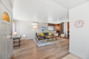 a living room with a couch and a table at Seashore Delight in San Diego