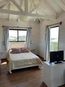 Postel nebo postele na pokoji v ubytování Cabañas Utopía