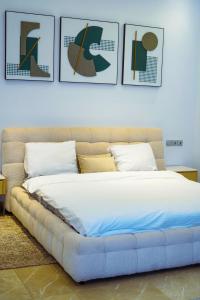 Ένα ή περισσότερα κρεβάτια σε δωμάτιο στο la Villa WOOR Saly Joseph +16 φωτογραφίες