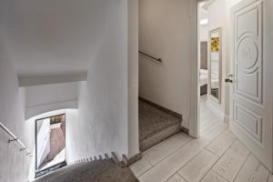 a hallway with a fireplace in a house at Isola nel Parco Villas & Rooms in La Maddalena +11 photos