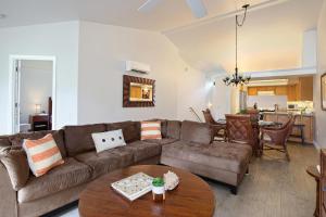 a living room with a couch and a table at Villas of Kamalii #35 in Princeville