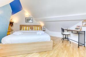 Ένα ή περισσότερα κρεβάτια σε δωμάτιο στο Splendid Marais 2BDR