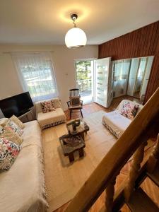 a living room with a couch and a table at Viva Sićevo 