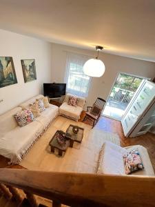 a living room with a couch and a table at Viva Sićevo in Železnička Stanica Sićevo