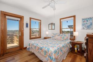 a bedroom with a bed and two windows at D124- Gillis in Sanderling +39 photos