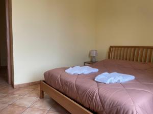 Ένα ή περισσότερα κρεβάτια σε δωμάτιο στο Fior Di Sambuco