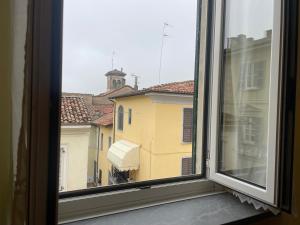 a window with a view of a city at Fior Di Sambuco in Broni