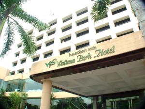 a building with a sign for the walt disney world hotel at Wattana Park Hotel in Trang