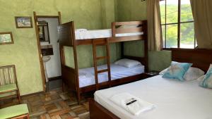 Ένα ή περισσότερα κρεβάτια σε δωμάτιο στο El Viejo y El Mar Hostal Restaurante