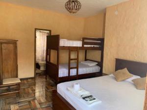 Ένα ή περισσότερα κρεβάτια σε δωμάτιο στο El Viejo y El Mar Hostal Restaurante