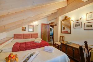 Ένα ή περισσότερα κρεβάτια σε δωμάτιο στο Antico Chalet Livigno