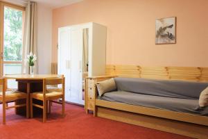 a bedroom with a bed and a desk and a table at Relax nel verde - WiFi & Parcheggio in Fanano