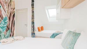 Postel nebo postele na pokoji v ubytování Résidence belle créole I Le Balisier I Duplex avec jacuzzi à 15min de Disneyland Paris